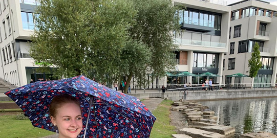 Sabrina under a colourful umbrella