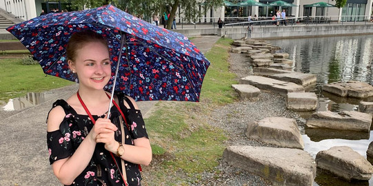 Sabrina under a colourful umbrella