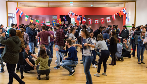 dancing international students in the International Meeting Center of TU Dortmund University