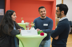 Scholarship recipients are in a conversation.
