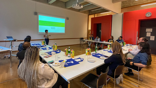 researchers listening to a scientific presentation
