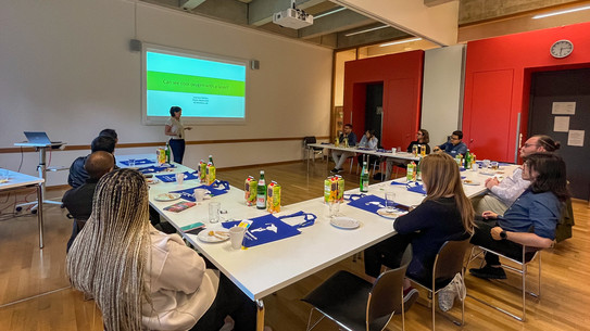 researchers listening to a scientific presentation