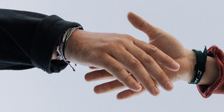 Two hands are touching each other