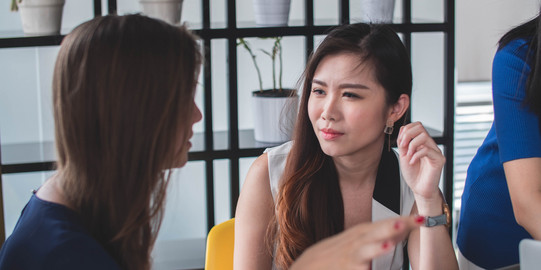 Two Women engaged in conversation