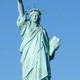 Statue of Liberty in front of a blue sky