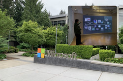 Hier sieht man das Headquarter Microsoft in Redmond von außen. Man sieht ein Microsoft Logo und viel Grün.