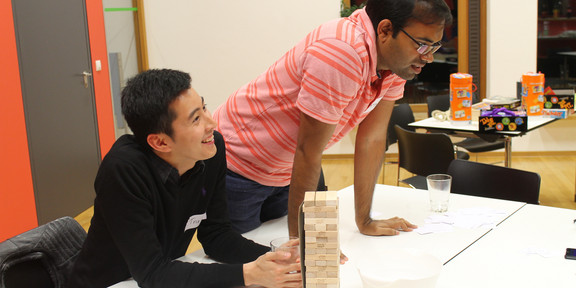 International researchers playing jenga at the International Meeting Center (IBZ)