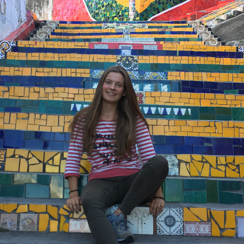 Maren is sitting on colorful steps