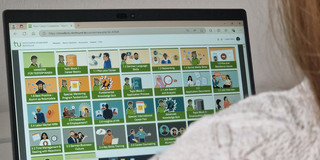 Focus on hands of a person browsing the Carrer Companion Moodle course