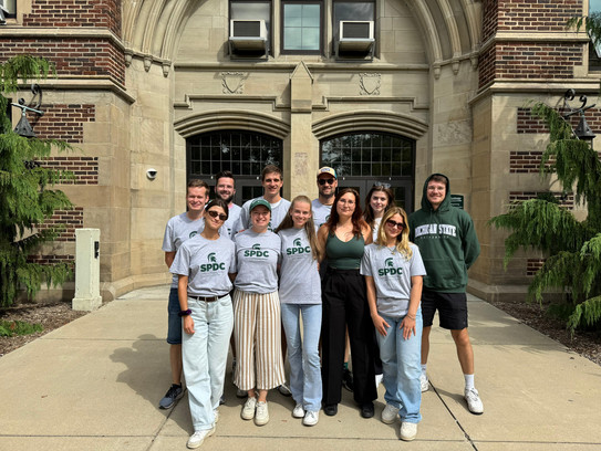 Group Picture A group of students standing in front of an old building on the campus