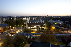 Brightly illuminated library of TU Dortmund University at night